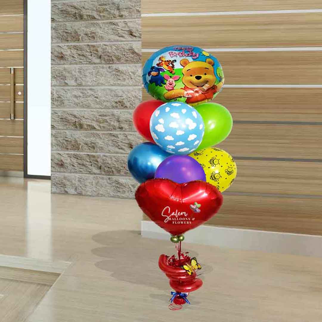 Winnie the Pooh themed birthday helium balloon bouquet. Salem Oregon balloon delivery. Birthday balloons Salem Oregon. Size chart.