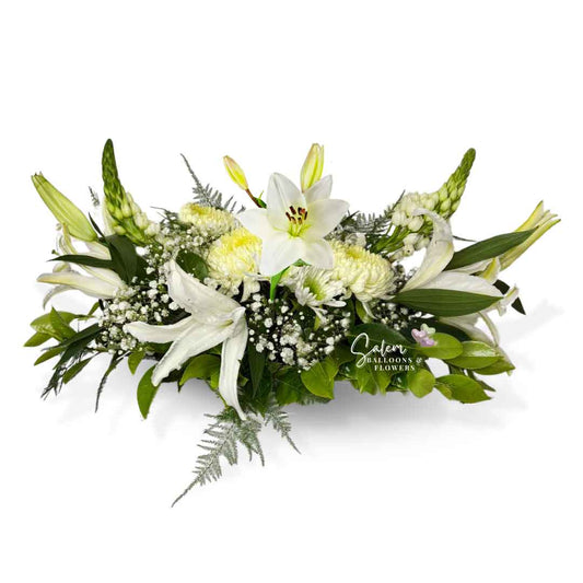 White flower arrangement, featuring white lilies, moms and dragon flowers. Salem Oregon Flower delivery.