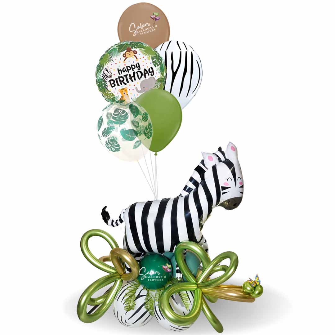 Safari themed balloon bouquet, featuring a zebra standing on a base of balloons and helium balloons. Balloons delivery Salem Oregon and nearby cities.