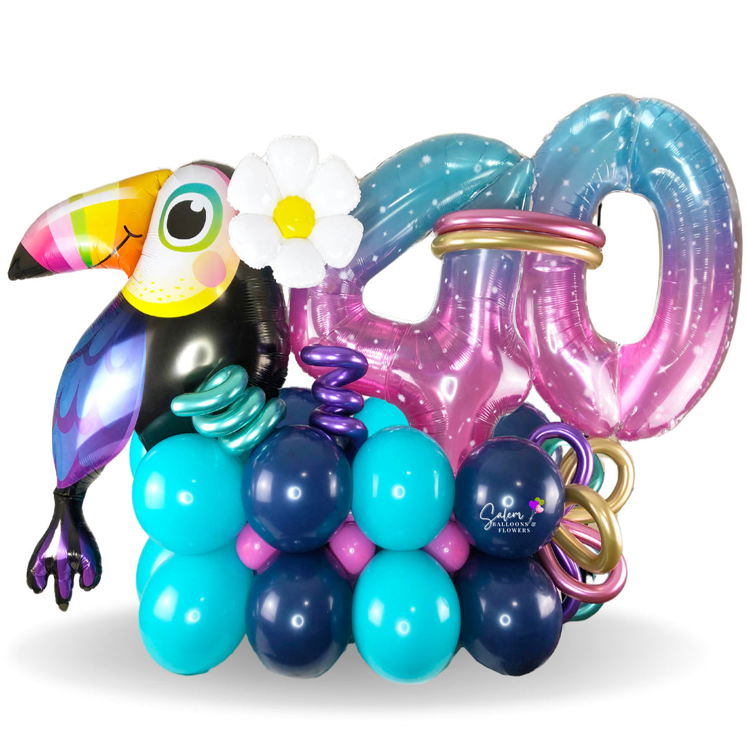 Happy Birthday balloon bouquet. Featuring an extra large gorgeous toucan balloon with balloon numbers in a very tropical style. Balloon delivery in Salem Oregon. Keizer Oregon.