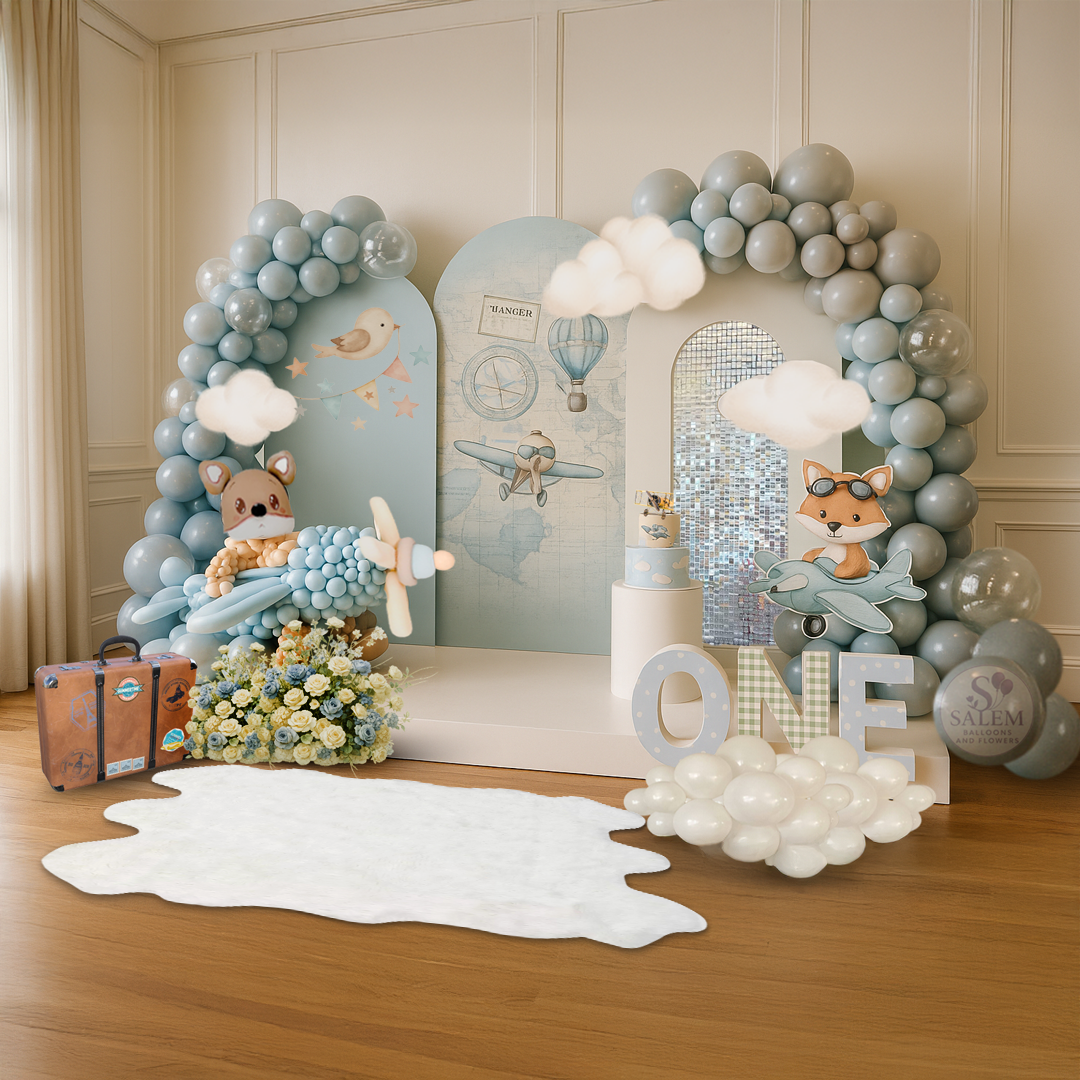 1st birthday balloon decor display. in pastel blues, featuring a large fox, 3 panels, and flowers. Balloon decor. Oregon.