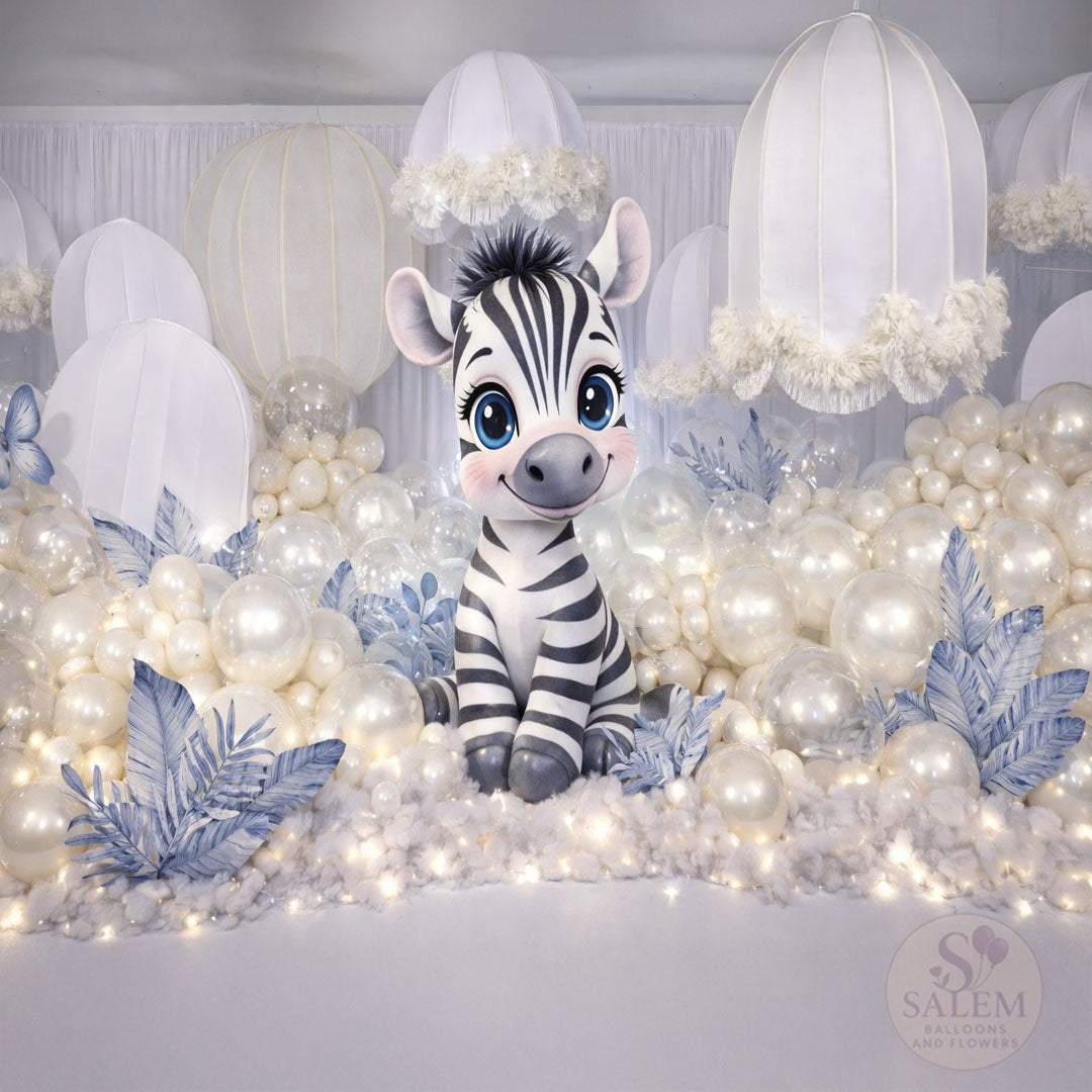 A baby zebra themed baby shower or gender reveal balloon decoration in pearl cream, white and blue. Oregon.