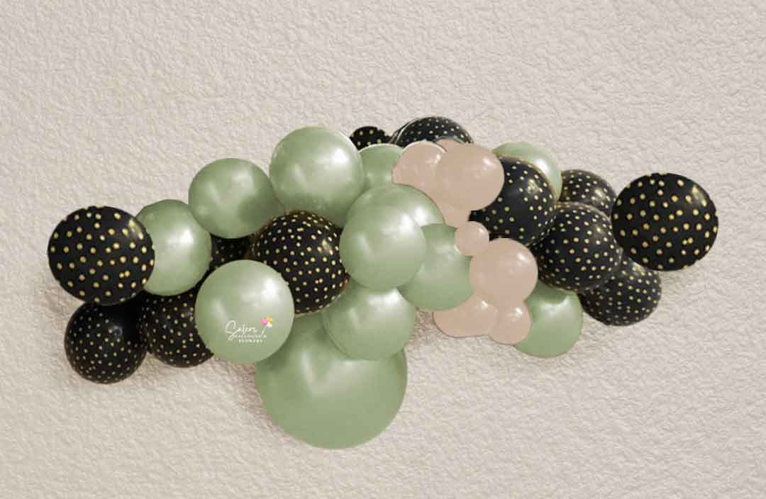 Organic balloon garland decorating a wall, in pearl green, sand and black balloon colors. Salem-Keizer Oregon balloon decor.