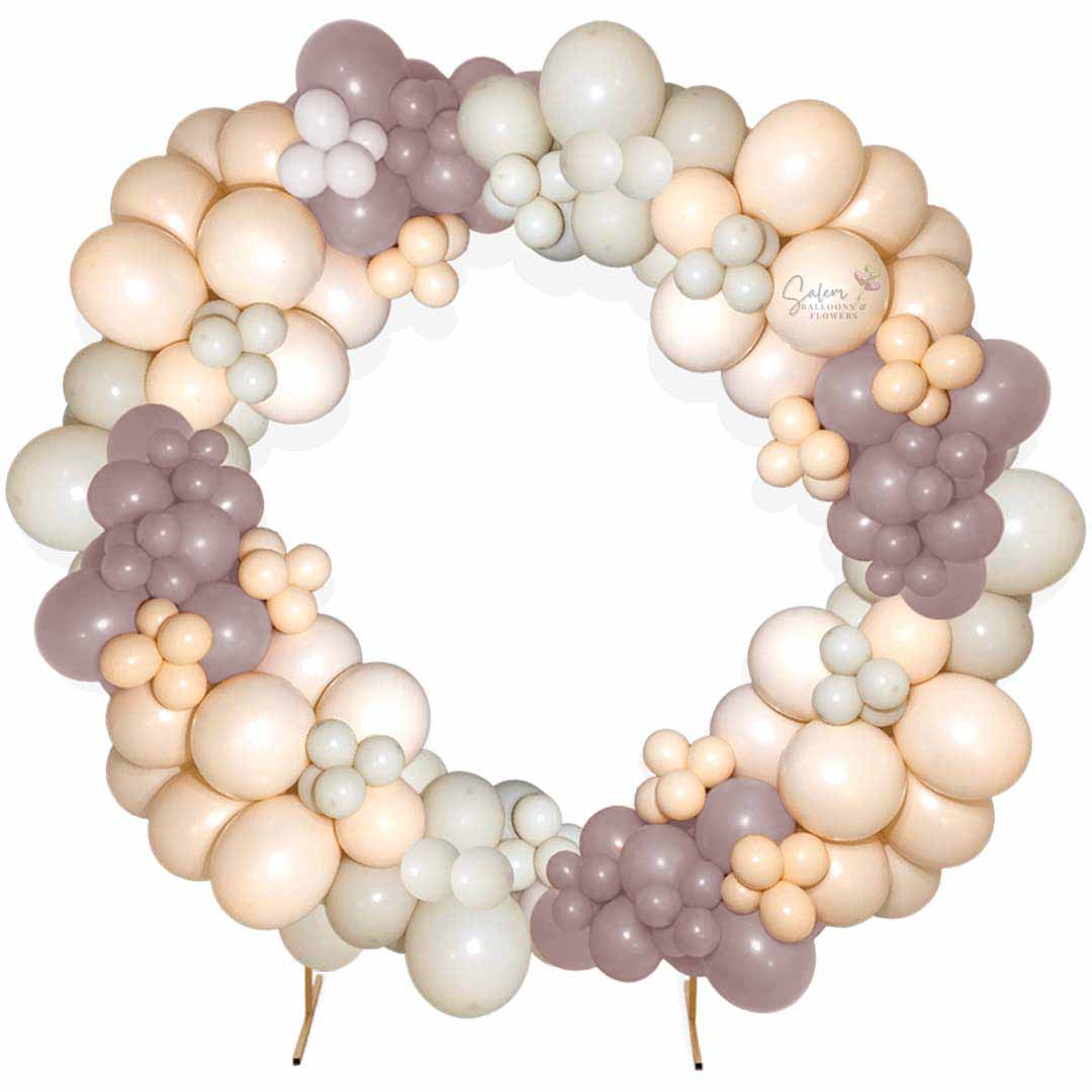 Balloon hoop. Balloon garland in a golden hoop frame in pink, white and blush. Salem Oregon Balloon decor.