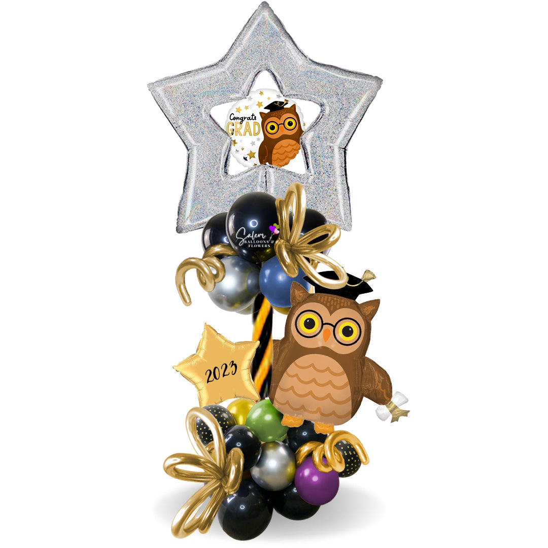 Congrats Grad balloon boquets. A large Owl wearing a grads hat in a balloon column.Salem Oregon balloon decor and balloon gifts delivery.
