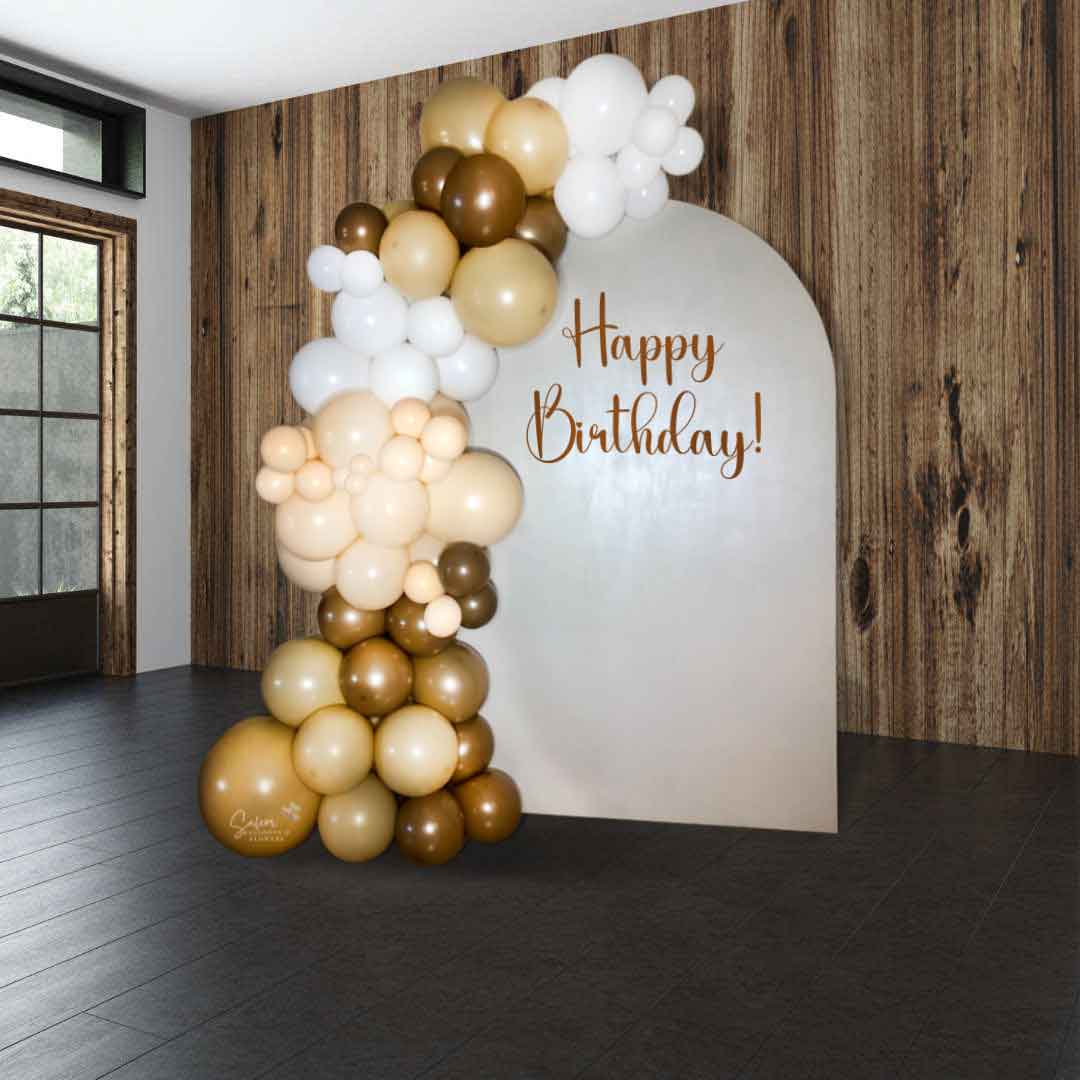 Organic balloon garland in brown, beige, blush and white decorating a single arch panel with a Happy birthday sign for Balloon decor. Oregon Balloon Decor.