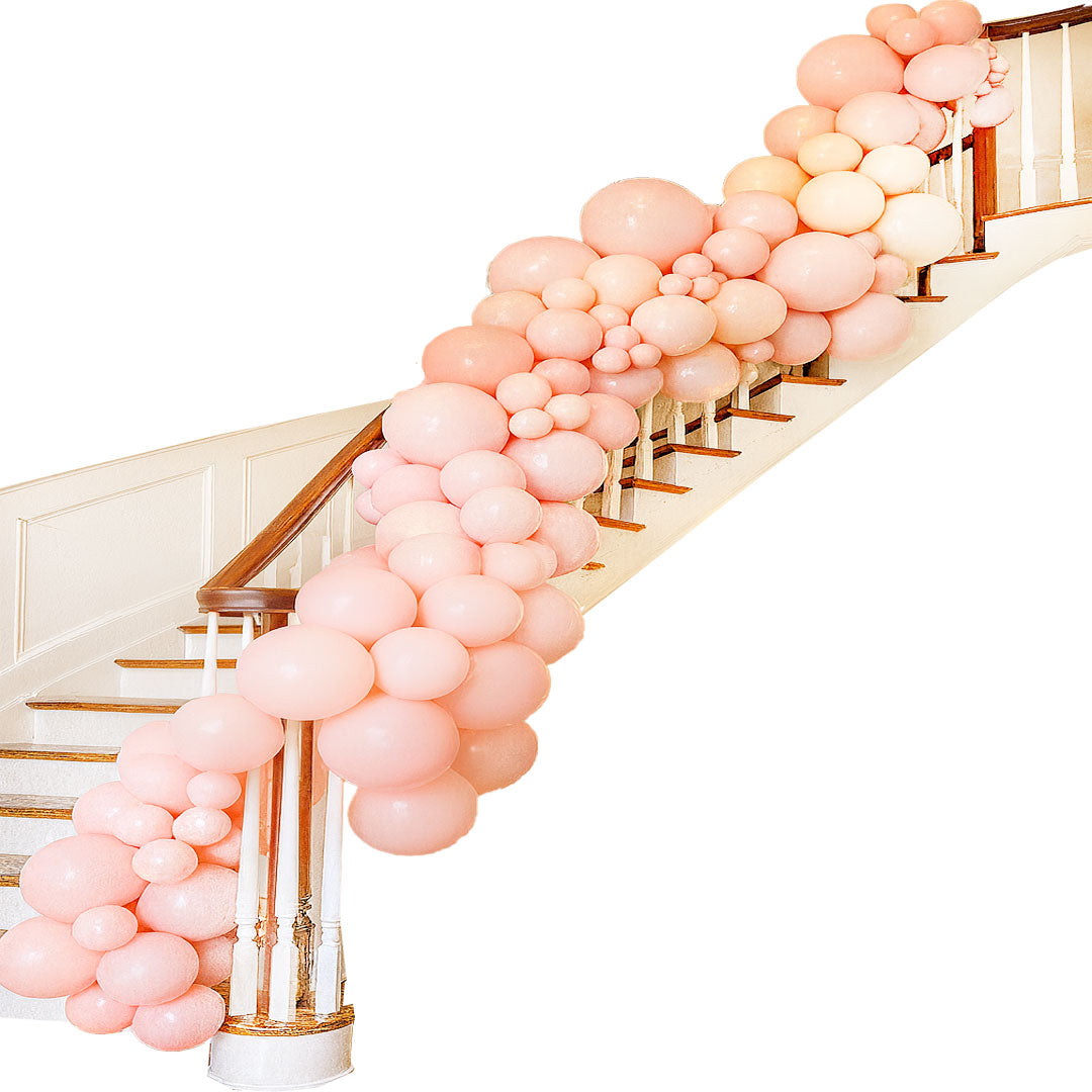 Balloon garland decorating staircase handrail by Salem Balloons and Flowers.
