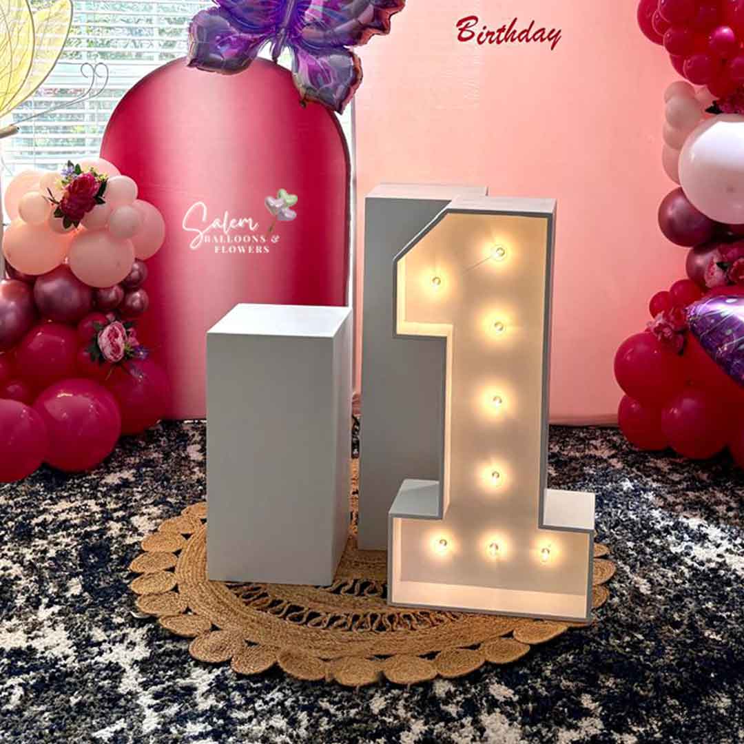 Light up marquee number with cake stands in front of a Pink Balloon Decoration. Balloon Decor Oregon.