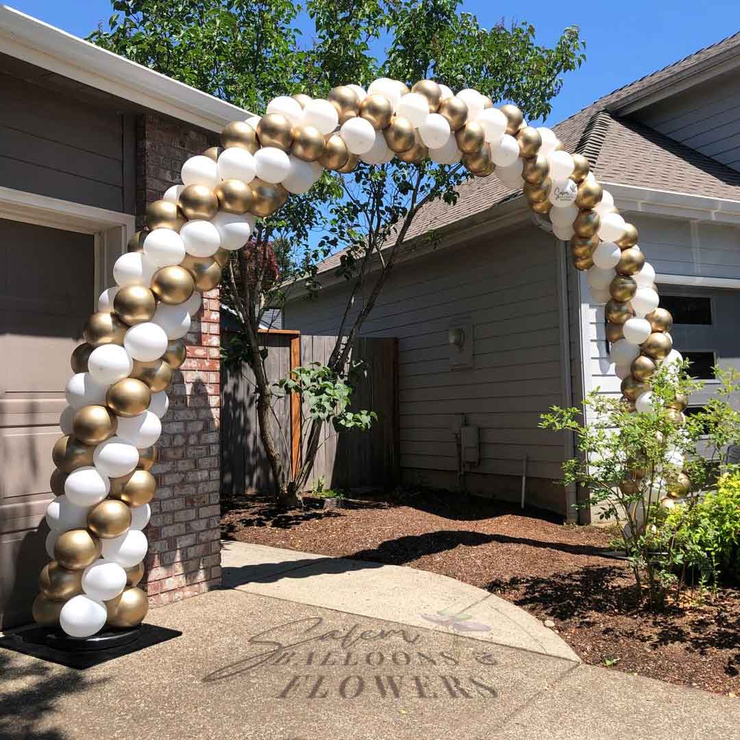 White and Gold Balloon Arch decorating a house backyard entrance. Salem Oregon Balloon decor. Balloon decorations Oregon. Balloon artist Oregon