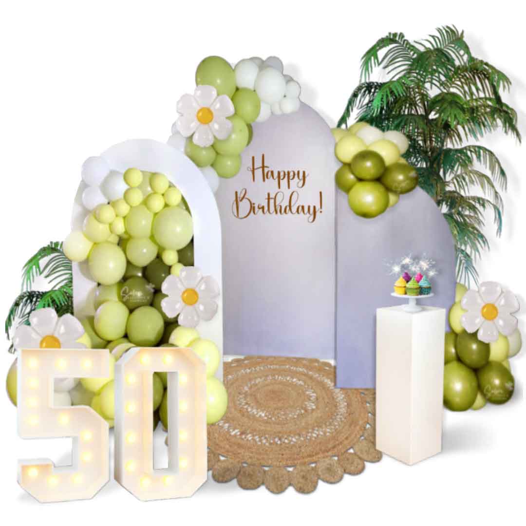 Balloon decoration with 3 panels, jute rug, plams, cake stand, marquee numbers. Oregon Balloon decor