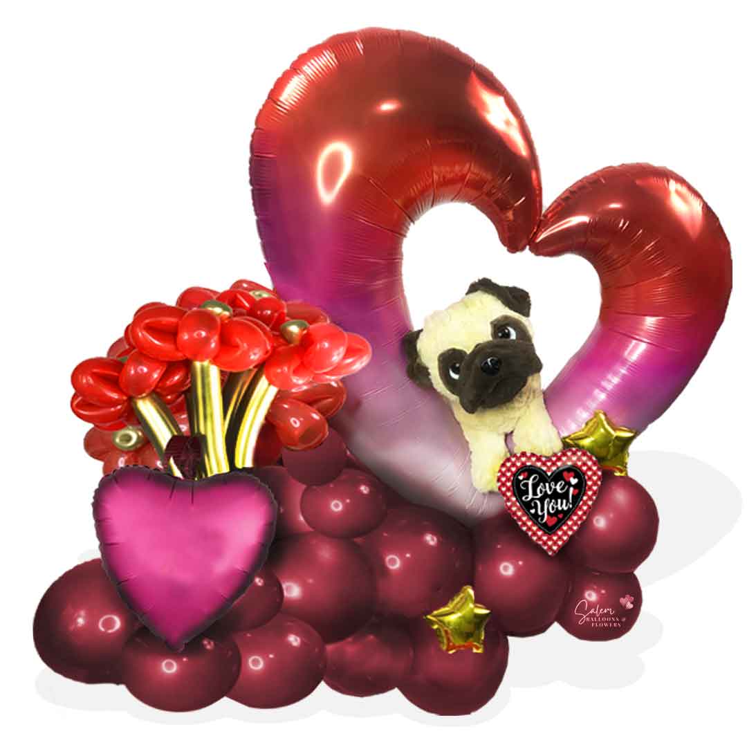 Valentine's Day balloon bouquet with a pug dog plush poking out through an open heart balloon. Salem Oregon balloon delivery