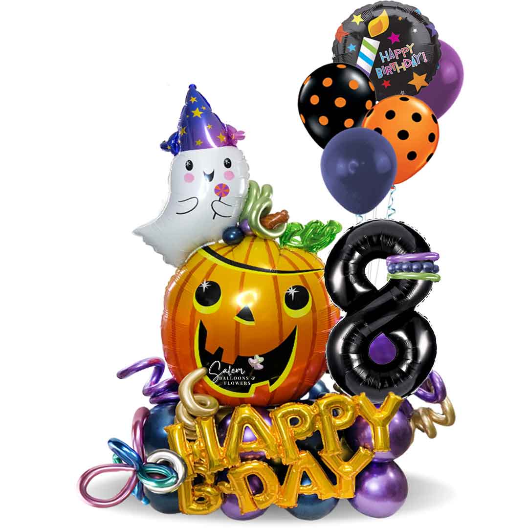 Halloween themed balloon bouquet. With a pumpkin balloon with a Happy birthday balloon and a number balloon. Oregon balloon decor.
