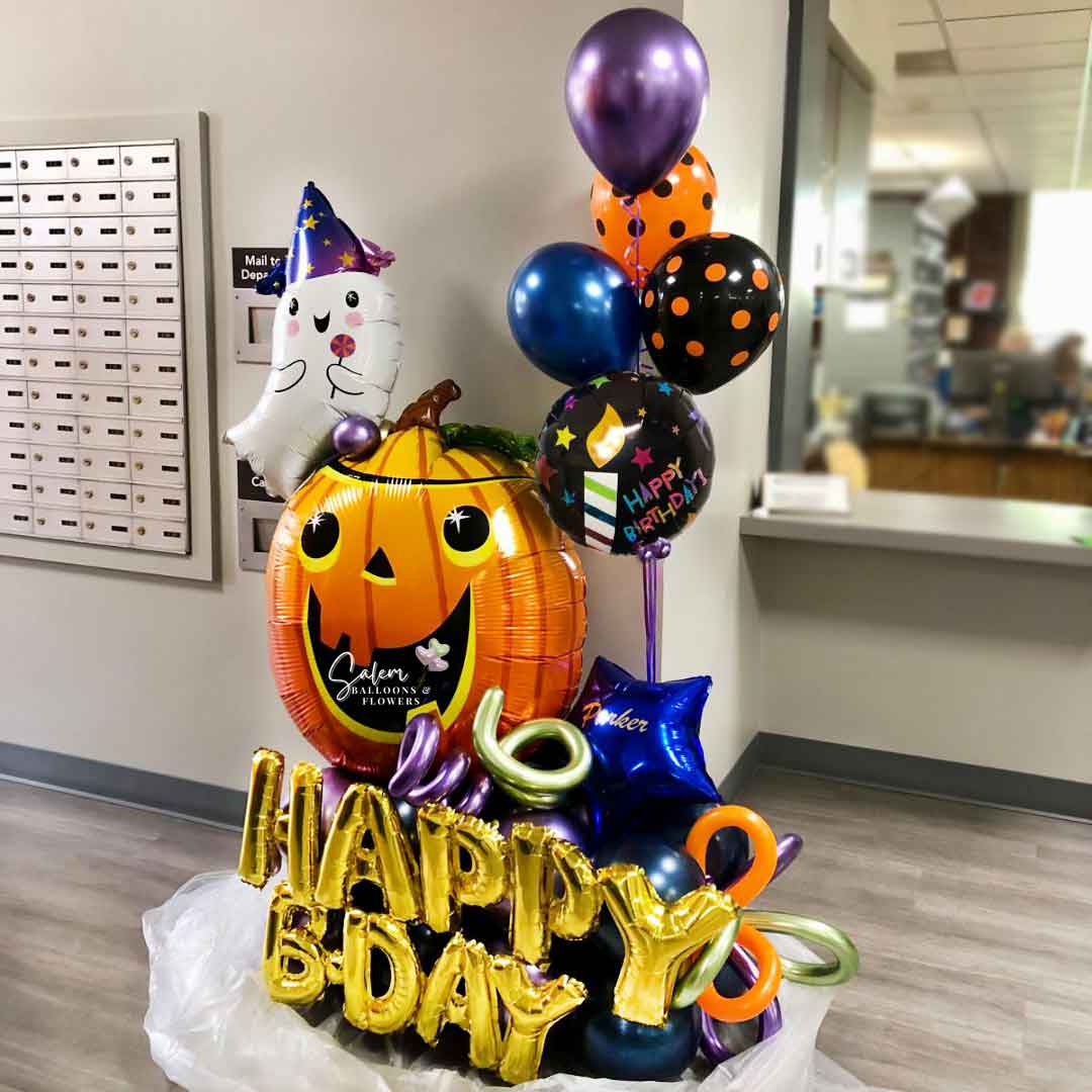 Halloween themed Birthday Balloon Bouquet. With a XL pumpkin balloon and a cute ghost. Balloons Salem Oregon. 