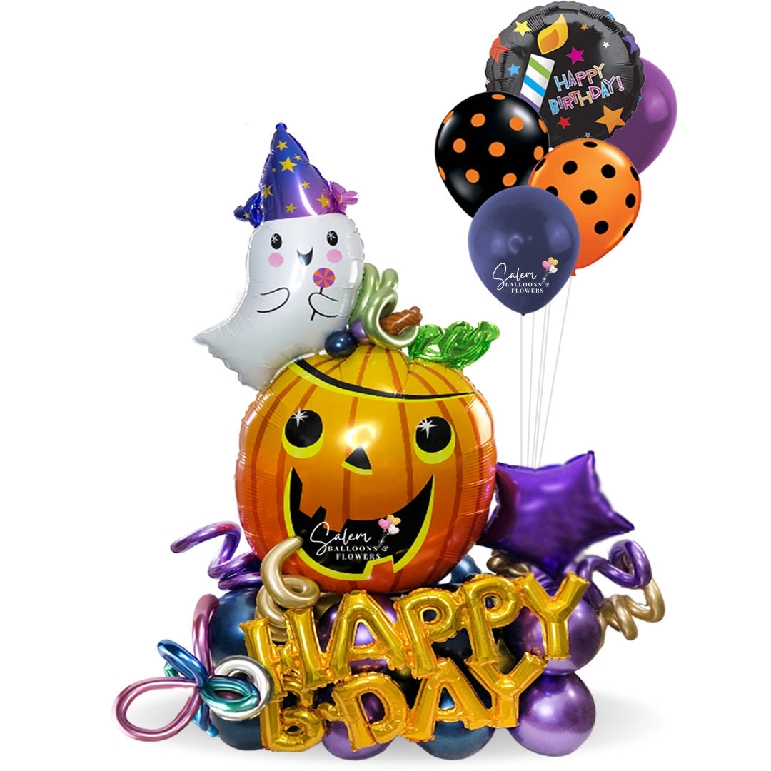 Halloween themed balloon bouquet. With a pumpkin balloon with a Happy birthday balloon. Oregon balloon decor.
