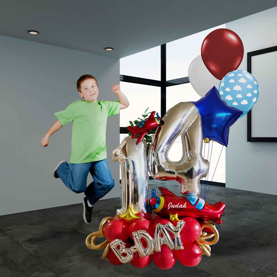 A kid jumping next to Airplane themed number balloon bouquet in vibrant colors with a set of helium balloons. Delivery in Salem Oregon and nearby cities.