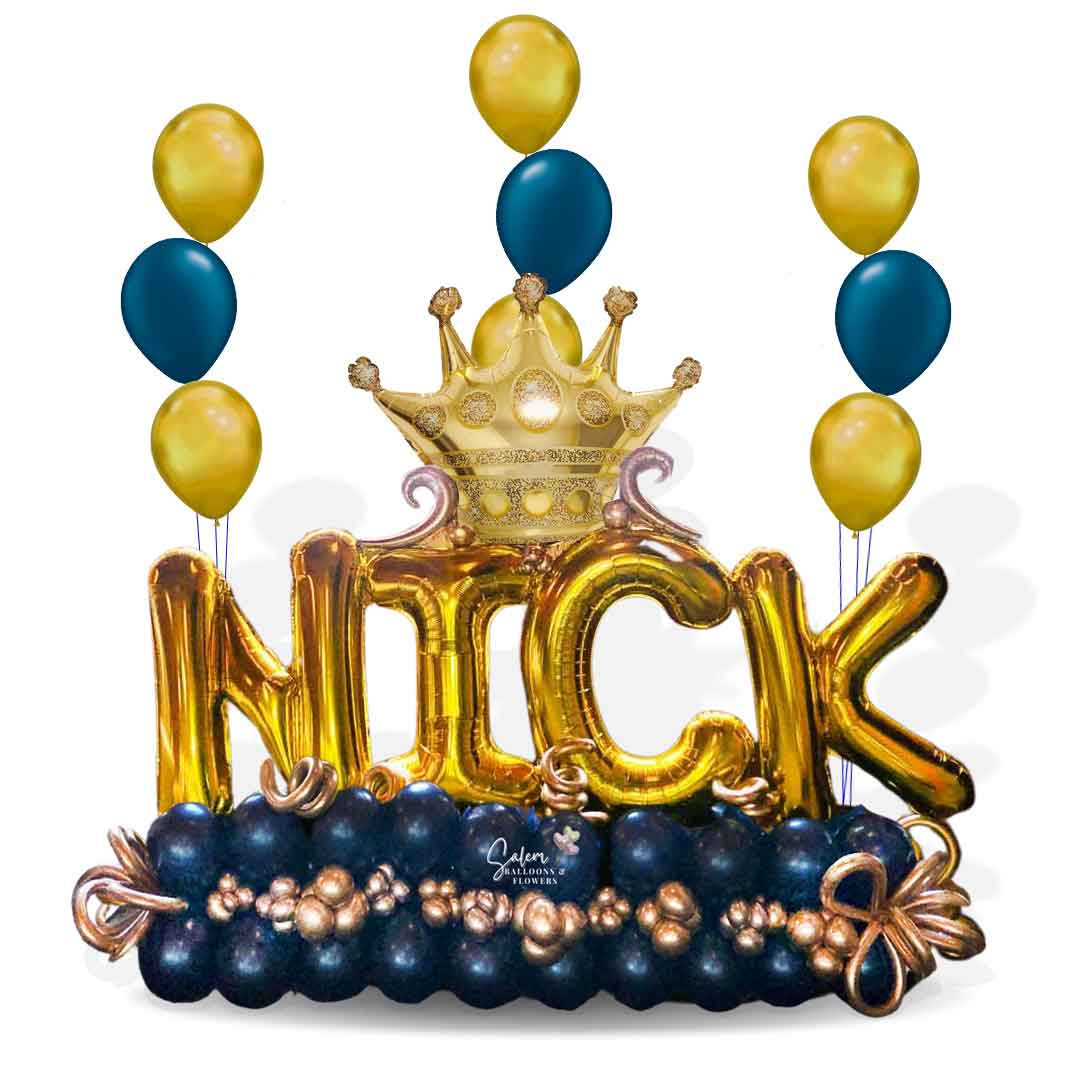 Extra large letter balloon bouquet in navy blue, gold balloon letters with a golden crown and 3 sets of 3 helium balloons. Salem Oregon balloon decor