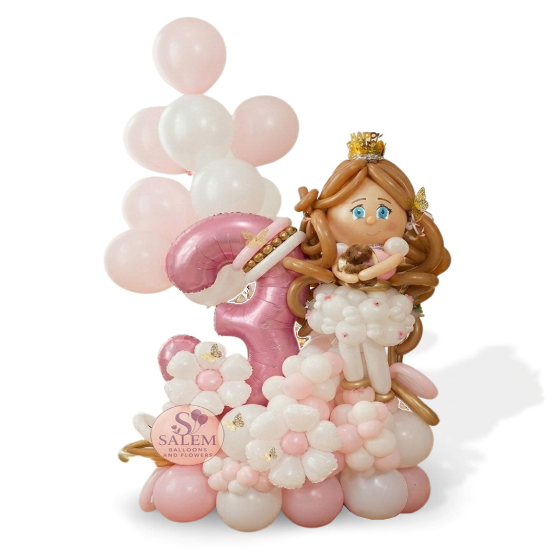 Large balloon arrangement decorated with a ballerina balloon doll holding a plush, a large #3  balloon  with flowers and helium balloons  in a home setting. Salem Oregon balloon delivery.