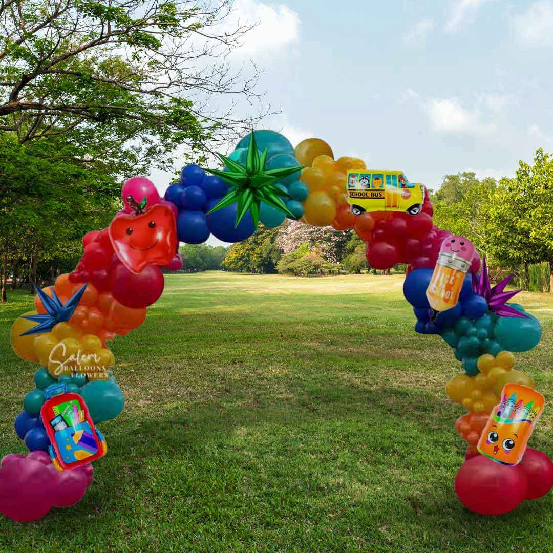 Colorful back to school themed balloon arch with various shapes and designs in a park setting. Salem Oregon.