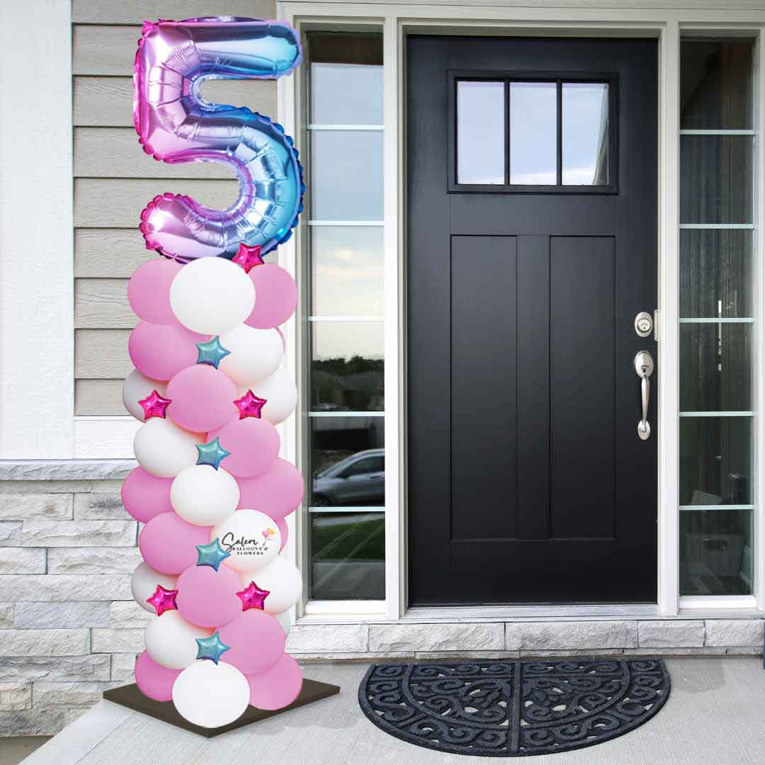 Pastel colors Balloon column with number standing in front of a doorway. Balloon decor Salem Oregon
