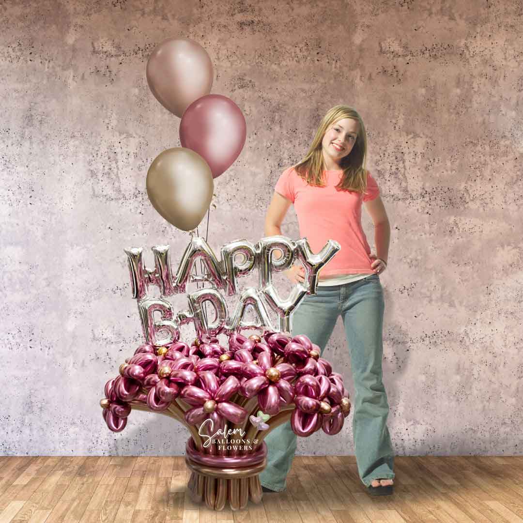 A young girl standing next to a gorgeous Extra large balloon bouquet, featuring handcrafted balloon flowers with a "Happy B-Day" balloon and a set of helium balloons. Salem Oregon balloon delivery.