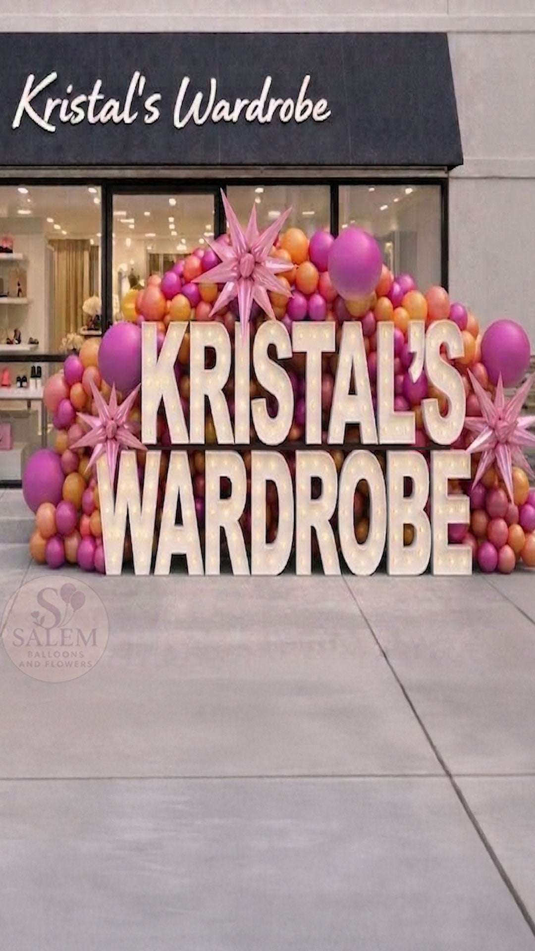 Storefront of Kristal's Wardrobe with decorative X-large Marquee letter display with balloons spelling Kristal's Wardrobe. Business storefront displays. Oregon.