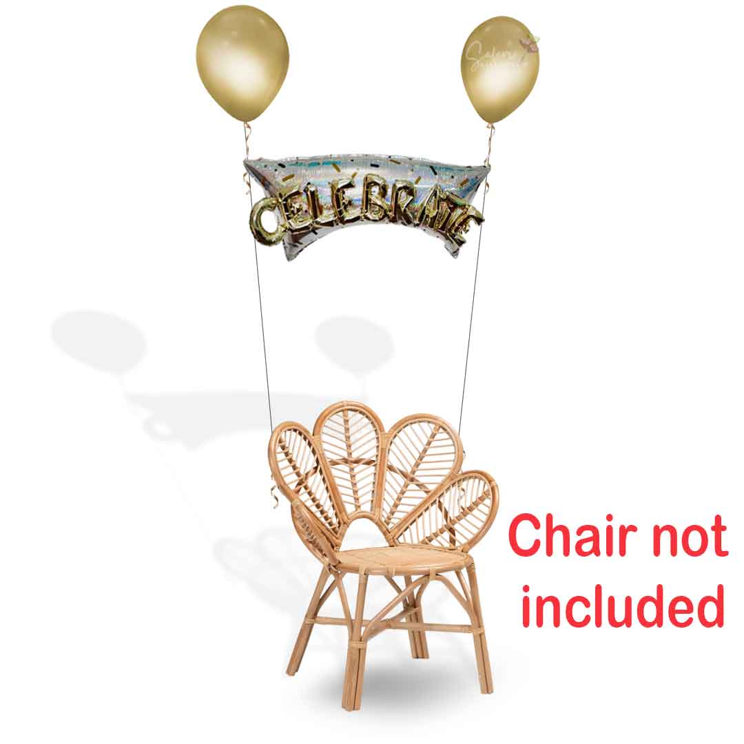 Helium balloon bouquet tied to a chair in gold and silver with the word "Celebrate". Oregon balloon delivery