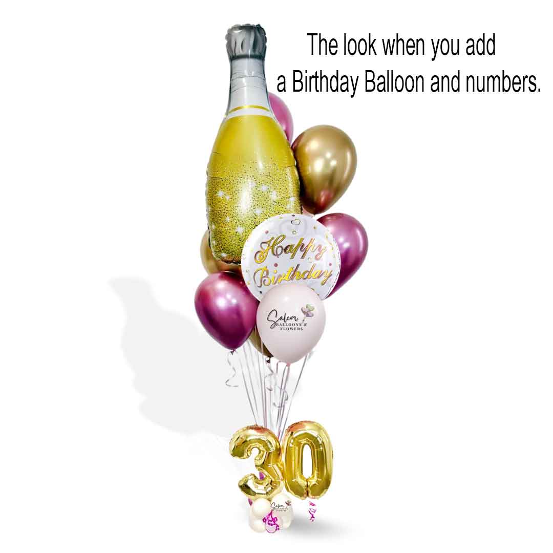 Helium Balloon Bouquet featuring a large champagne balloon bottle, a happy birthday balloon and number balloons in a gold and pink color palette. Balloon delivery. Salem Oregon and nearby cities
