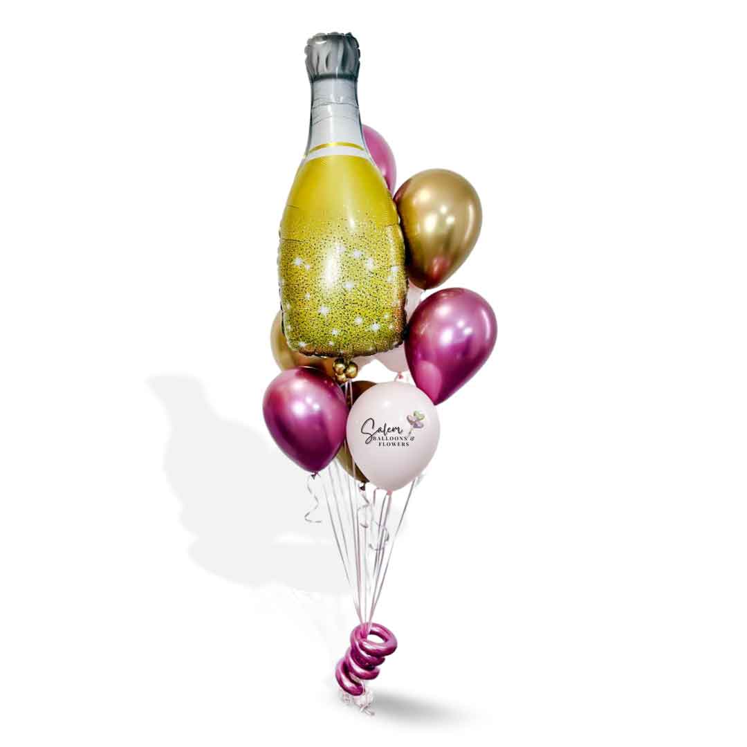 Helium Balloon Bouquet featuring a large champagne balloon bottle in gold and pink. Balloon delivery. Oregon