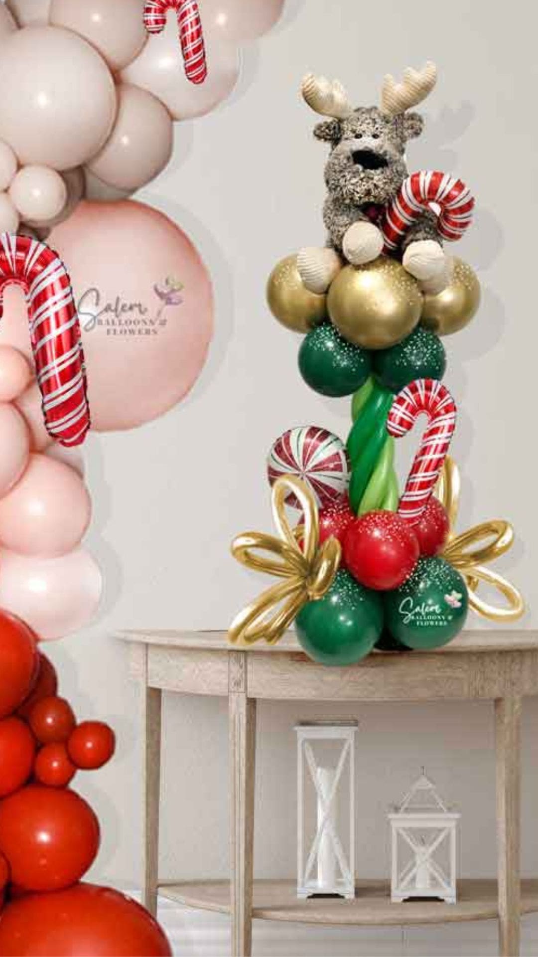Christmas balloon decor, featuring a half column with a reindeer plush. Christmas balloons Salem Oregon and nearby cities.