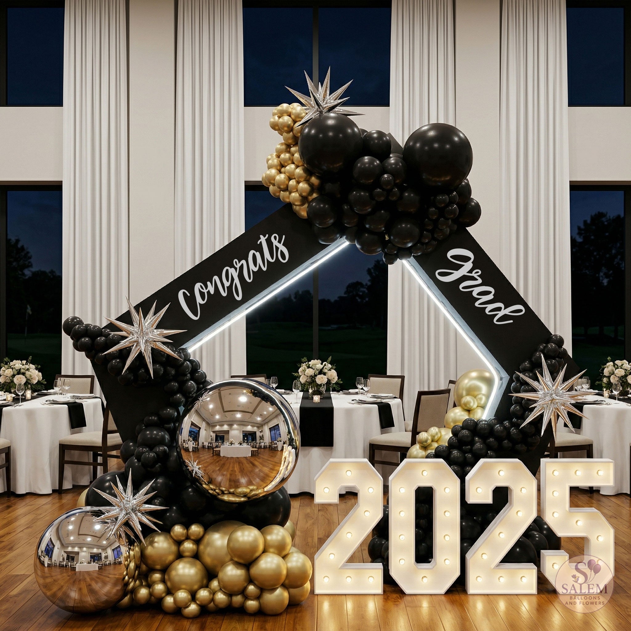 Graduation-themed decorations with balloon arch in a diamond shape  and 'Congrats Grad 2025' sign and "2025" lit marquee number display in a formal setting. Balloon decor. Oregon.