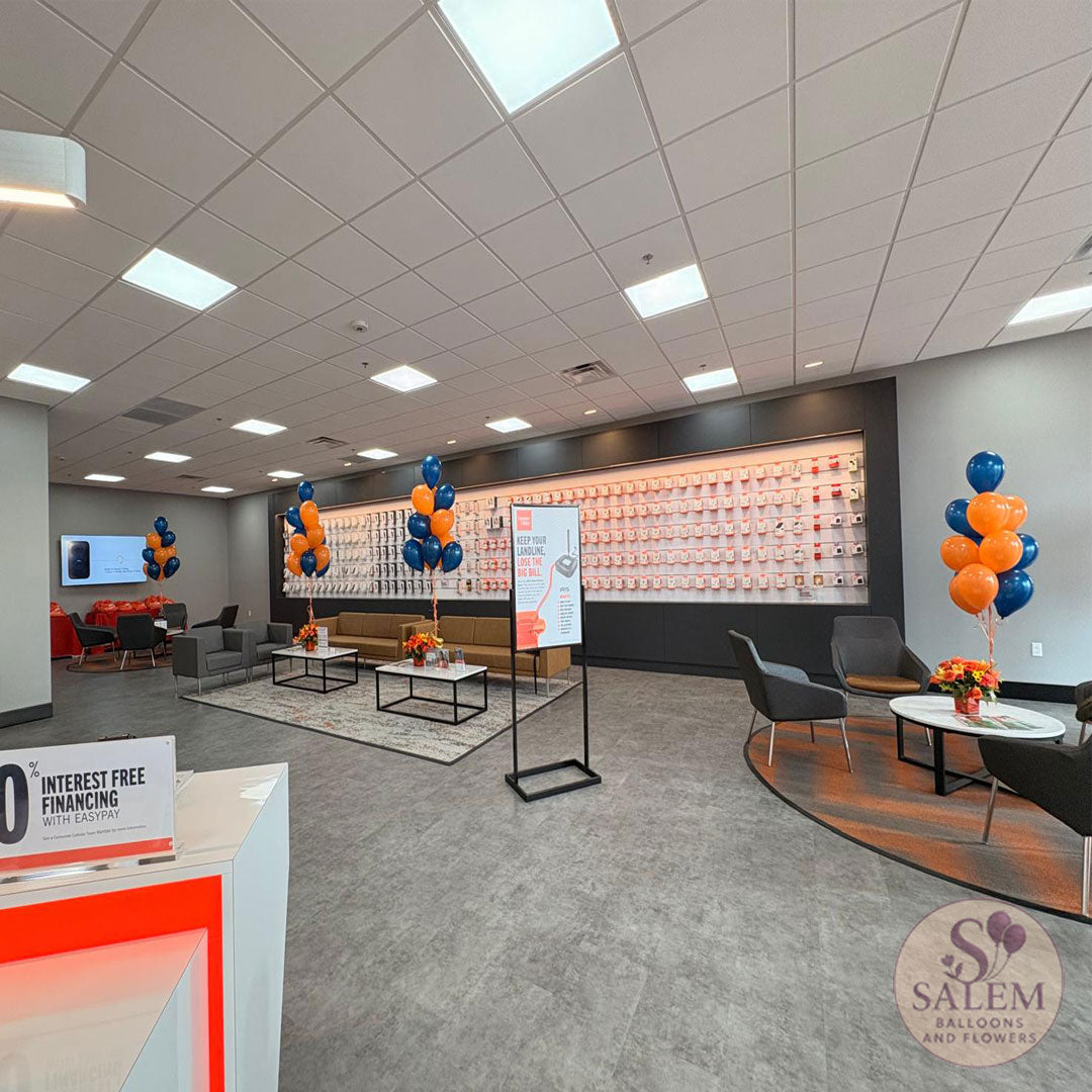 Helium balloon bouquets with flower arrangements for grand opening of the  Consumer Cellular 100 store in Salem Oregon by Salem Balloons and Flowers.