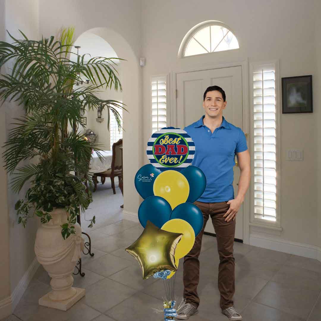 A dad standing next to a Happy Father's Day Balloon Bouquet. Featuring a Dad #1 message balloon and a baseball balloon with a set of colorful helium-filled balloons, anchored to a decorated weight. Delivery in Salem Oregon and neabry cities.