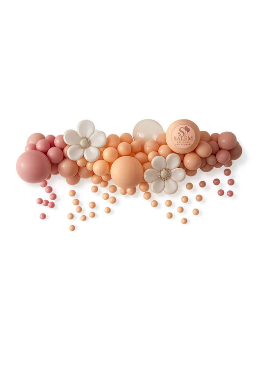 Organic balloon garland enhanced with balloon flowers, bubble balloons and a balloon drop cascade in pink, blush and cream. Balloon decor. Oregon.
