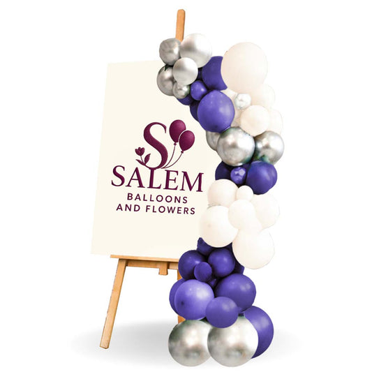 On a white background , a balloon garland on an Easel in blue, white and silver colors. Salem Oregon Balloon decor. Balloon decorations.