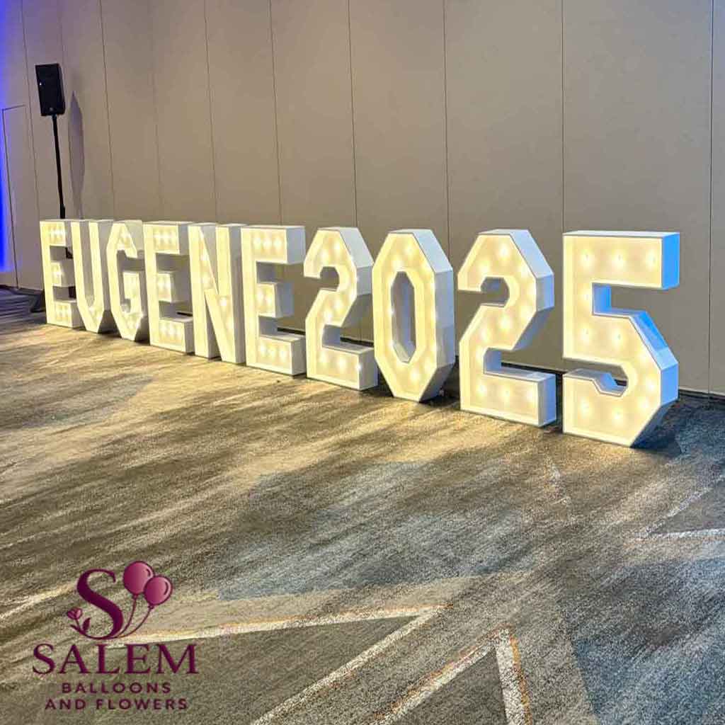Lit up Marquee Letters display spelling "EUGENE25" Marquee Letter rental service. Oregon.