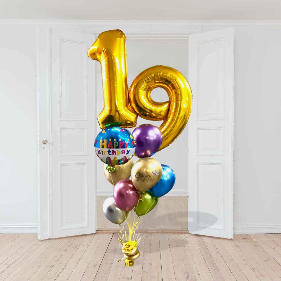 Two Extra large gold balloon numbers plus a  happy birthday Mylar balloon and a set of colorful  Chrome balloons anchored to a decorated balloon weight. Delivery in Salem-Keizer Oregon and nearby cities.