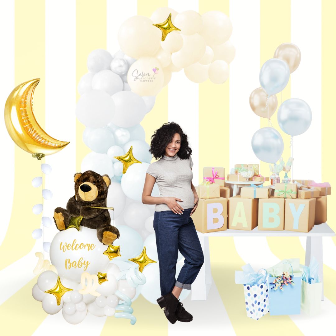 A mom to be standing in front of a  teddy bear plush fishing stars on a balloon bouquet and a balloon barland in pastel colors. A moon balloon floats next  this balloon decoration, helium balloons and gifts. Salem oregon balloon decor