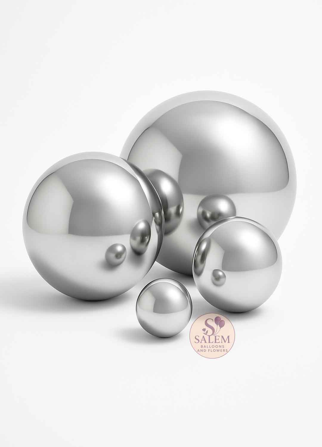 Set of silver giant chromel spheres on a white background. Oregon party rental