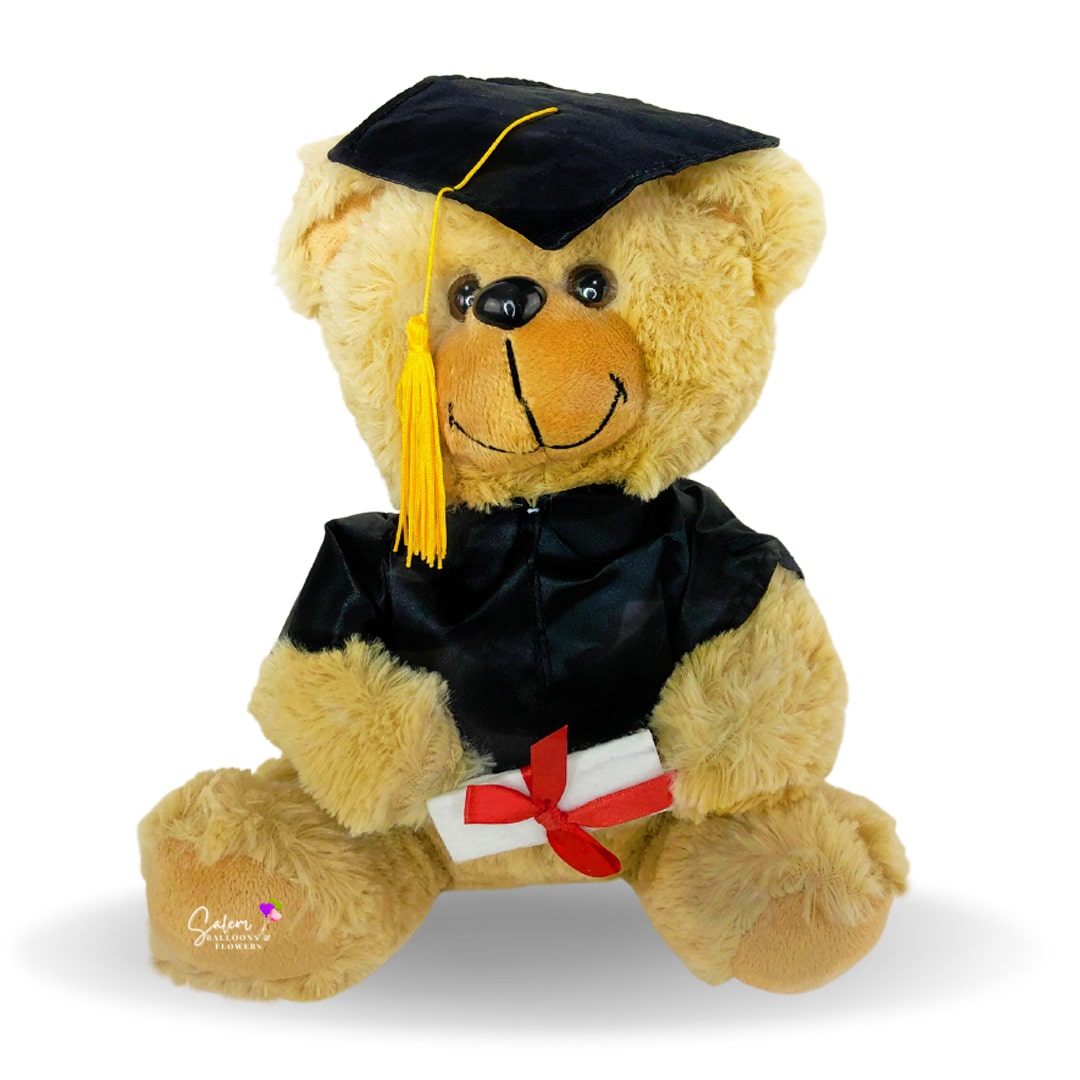 Teddy bear wearing a black grad gown. Balloon delivery in Salem Oregon and nearby cities.