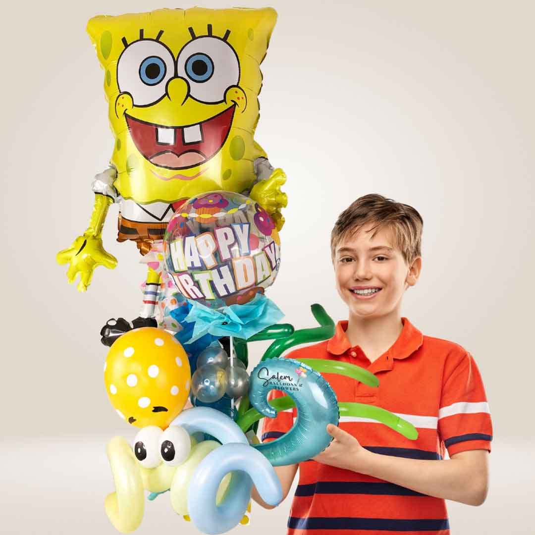 A boy holding a SpongeBob-themed Happy Birthday Balloon bouquet. Balloon delivery Salem Oregon and nearby cities.