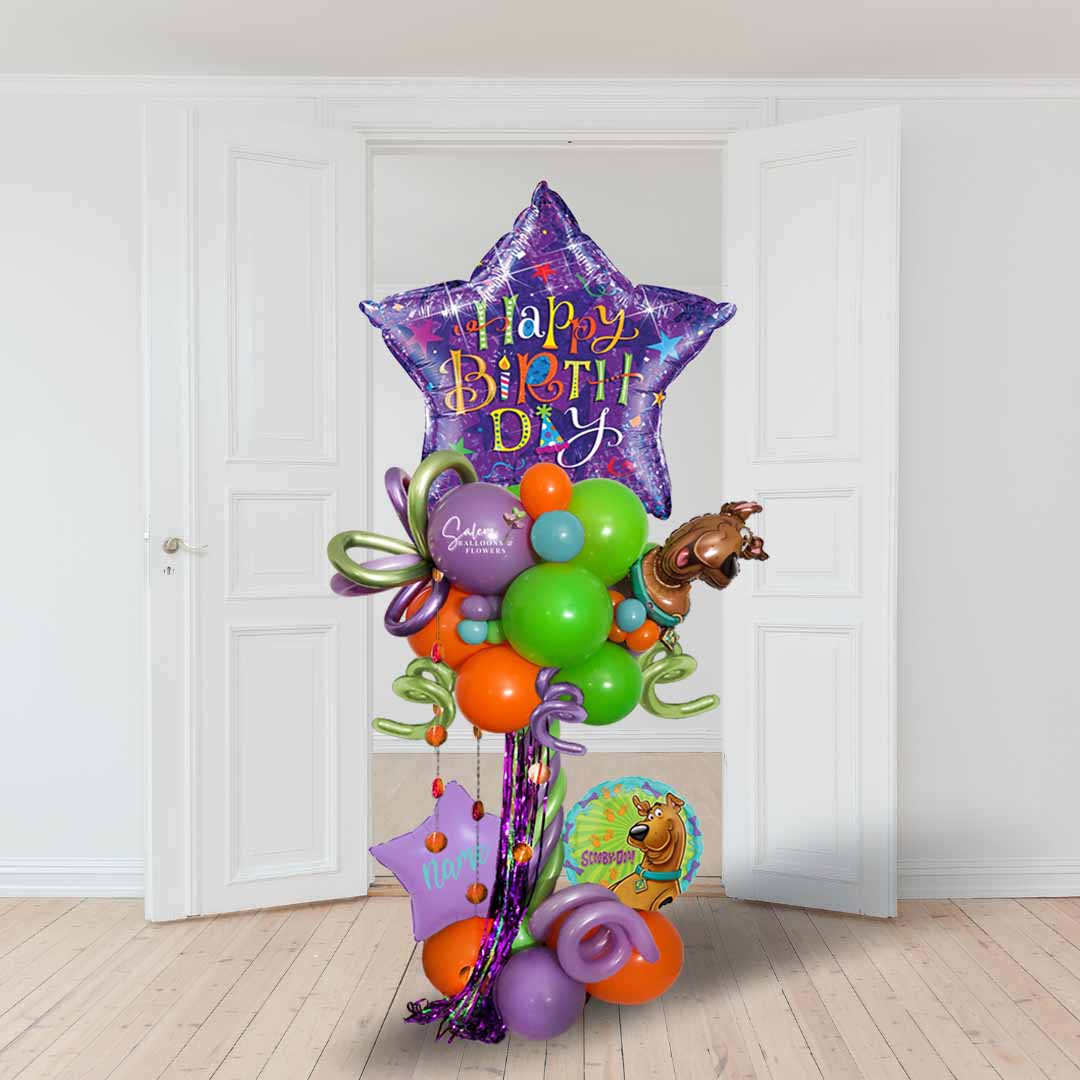 Scooby Doo themed birthday balloon column in purple and orange. Size chart approx 6 foot.  Salem Oregon Balloon Decor.