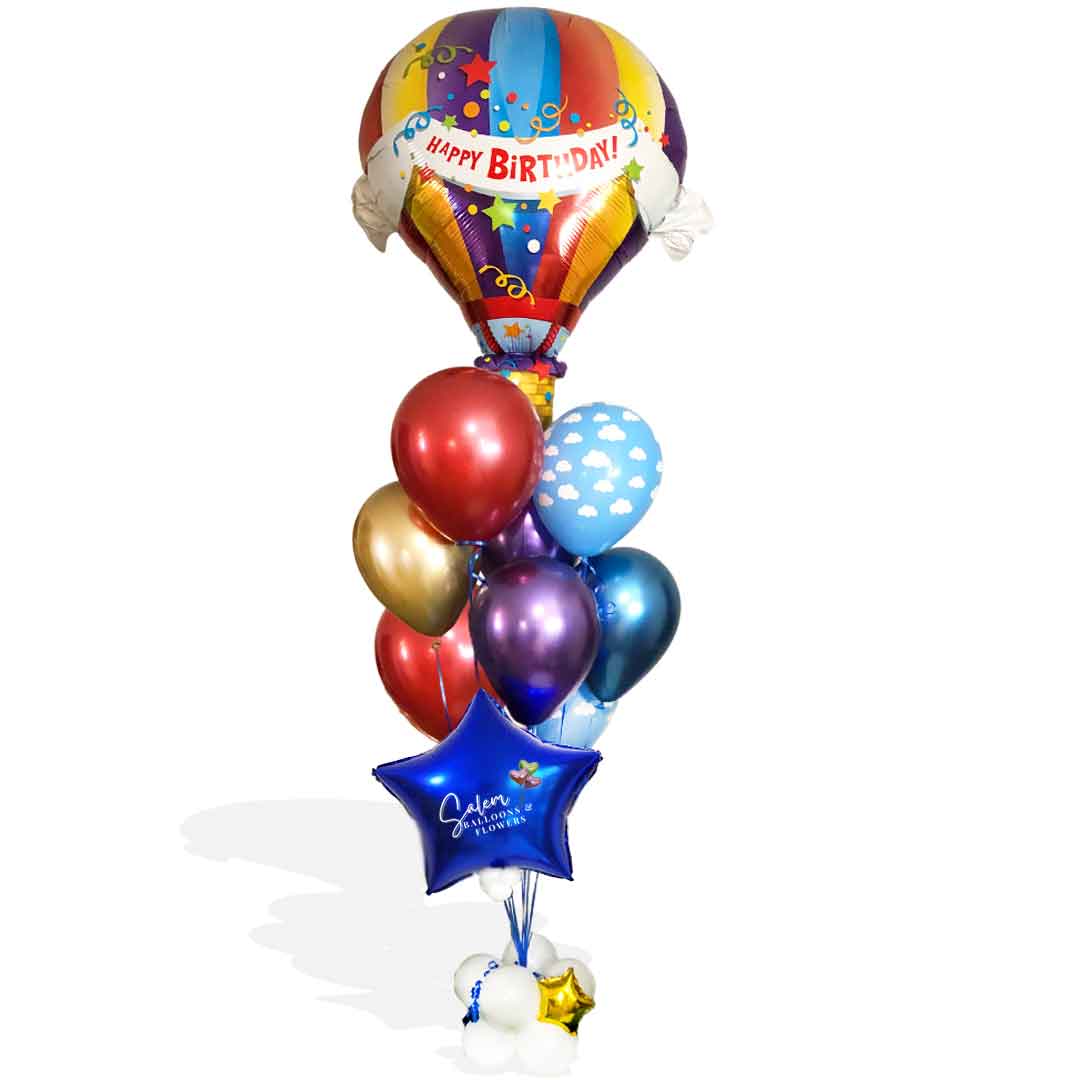 Birthday balloon delivery in Salem Oregon and nearby cities. Celebrate in style with our exquisite HBD Hot Air Classic Balloon Bouquet. Designed with your special occasion in mind, this exquisite bouquet features an extra large Hot Air Balloon, with a magical array of Chrome balloons, all anchored to a cloud decorated with golden stars and lots of ribbon. Perfect for a luxe birthday celebration.