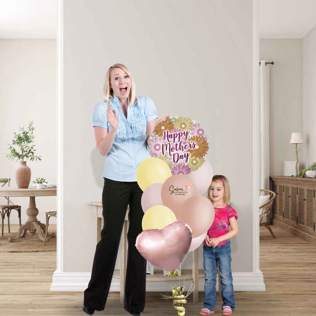 Mom and daughter standing next to a Mother's Day balloon bouquet, featuring a Gerbera flowers balloon with a 