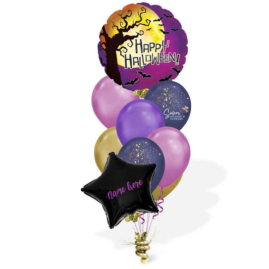 Helium filled halloween balloon bouquet. In dark blue, purple and fuchsia colors.  Featuring a round Mylar balloon with a "Happy Halloween" message. Oregon Balloon delivery