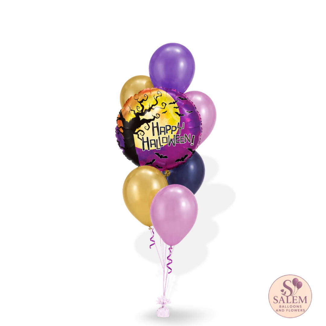 A cluster of metallic balloons for Halloween, featuring a central foil balloon with a 'Happy Halloween' design, surrounded by purple, gold, pink, and navy latex balloons on a white background.