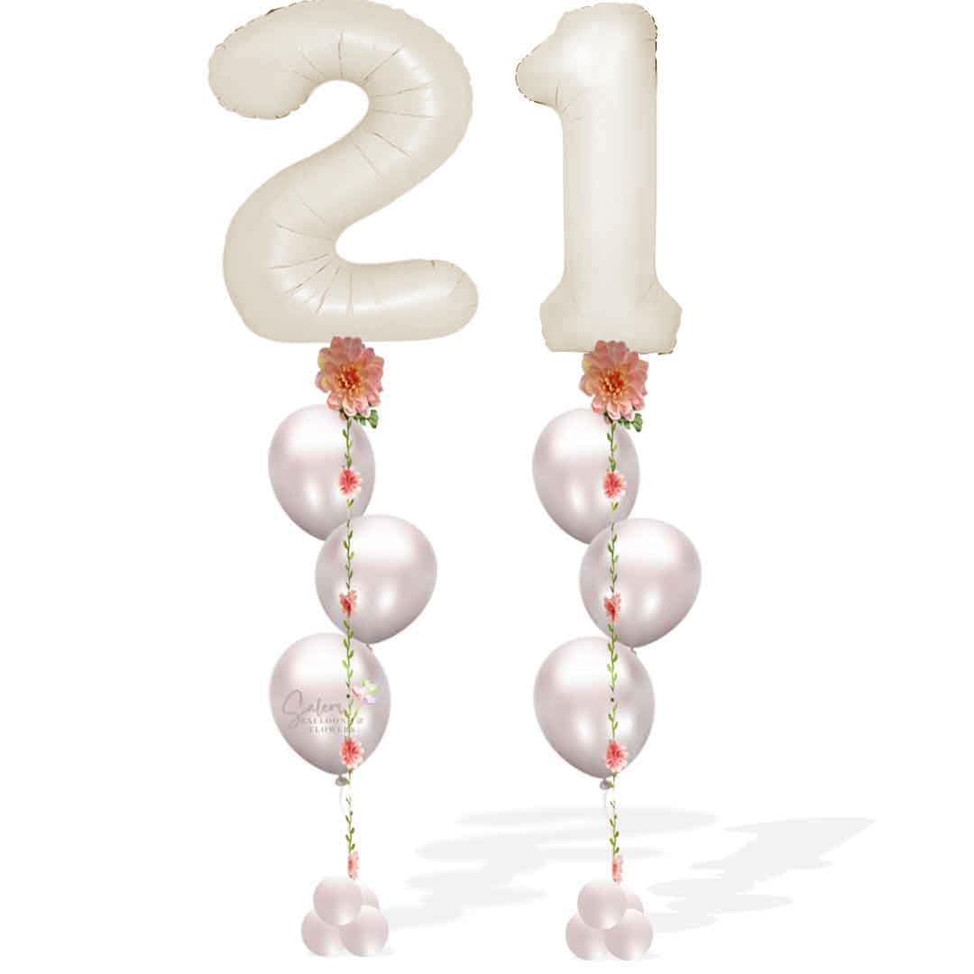 Two beige helium balloon numbers anchored to an Ivy ribbon with helium latex balloons. Balloons Salem Oregon