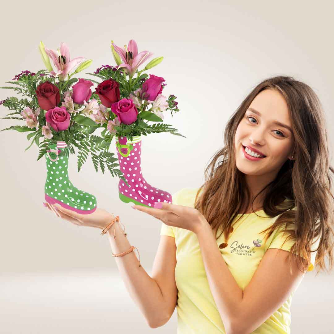 a young girl holding a ceramic boot with flowers. Flower delivery Salem Oregon