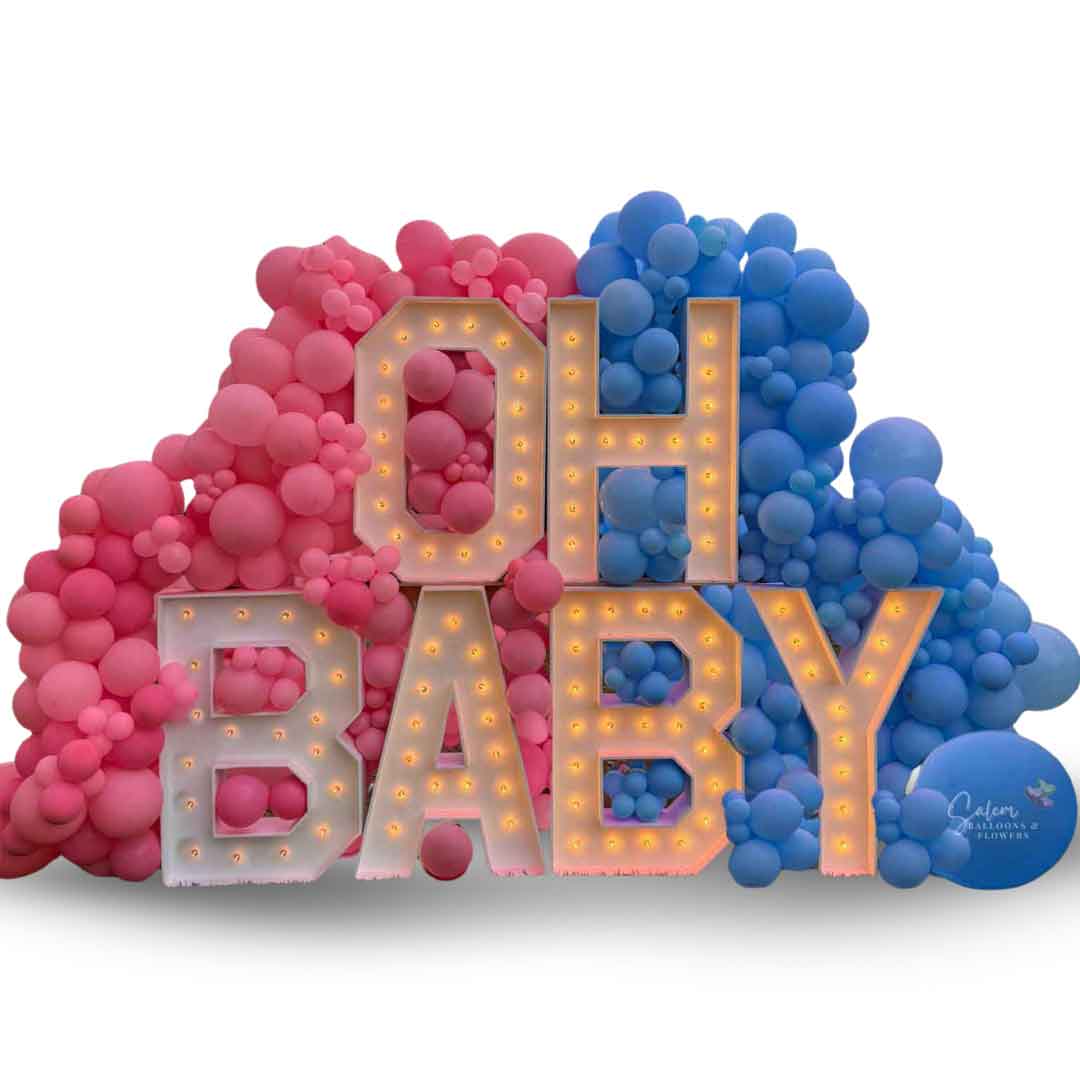 "OH Baby" Gender Reveal Marquee Letter Display. 3ft Marquee letters nested into a pink and blue balloon wall. Balloon Decor and rentals in Oregon.