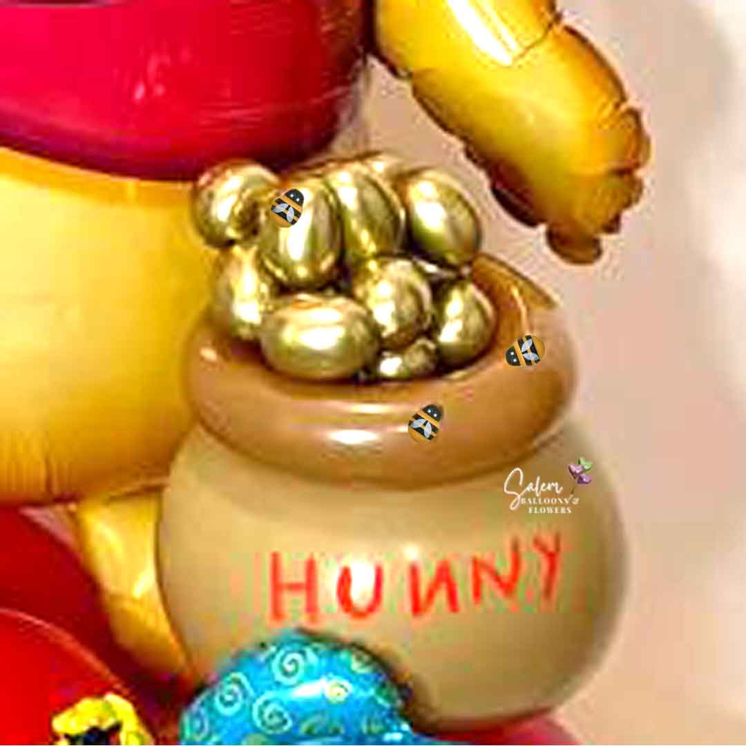 a balloon honey pot filled with honey and bees. Small details that make the difference. Oregon balloon delivery.