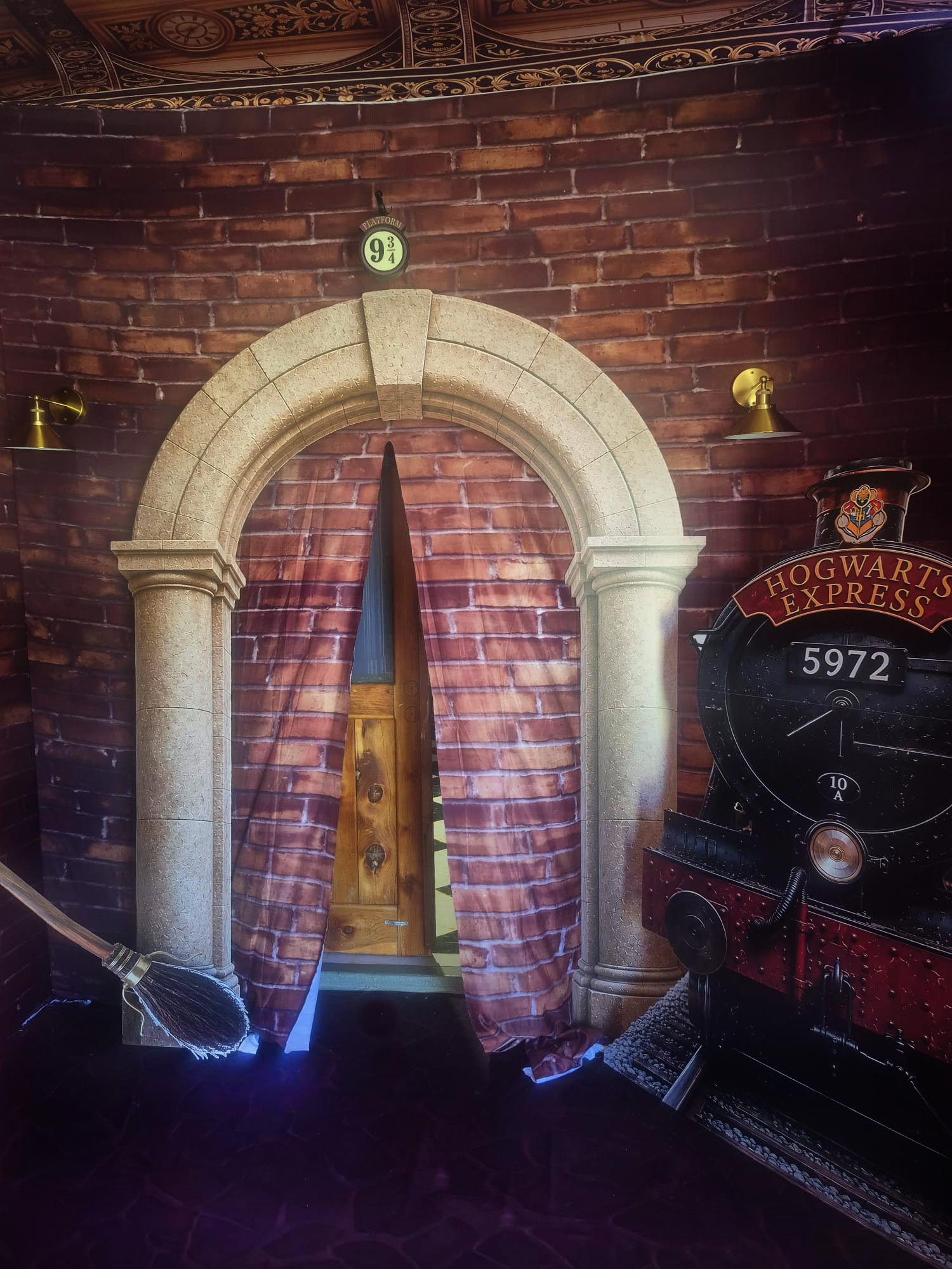 Large-scale immersive event installation with themed environments and balloon décor